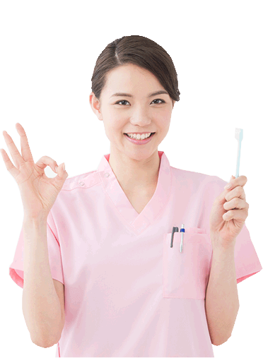 歯科衛生士が歯ブラシを持っている